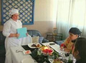 Dayana serving her teachers as part of her final exams